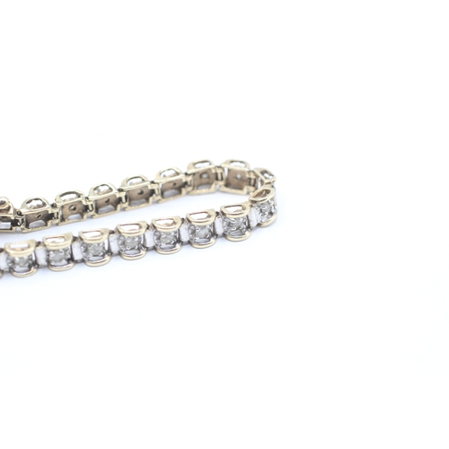 164 - 9ct gold diamond line bracelet (8.1g)