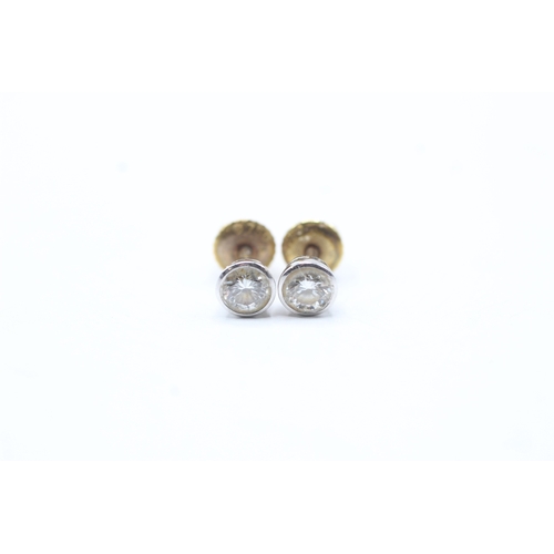 184 - 18ct gold diamond stud earrings (1.4g)