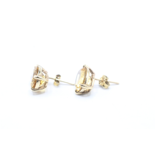 209 - 9ct gold oval cut citrine stud earrings (4.7g)