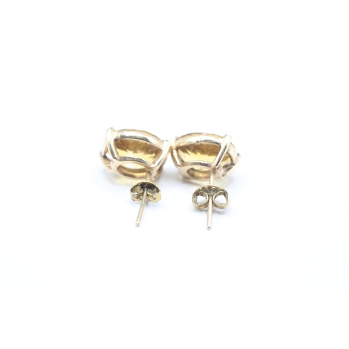 209 - 9ct gold oval cut citrine stud earrings (4.7g)