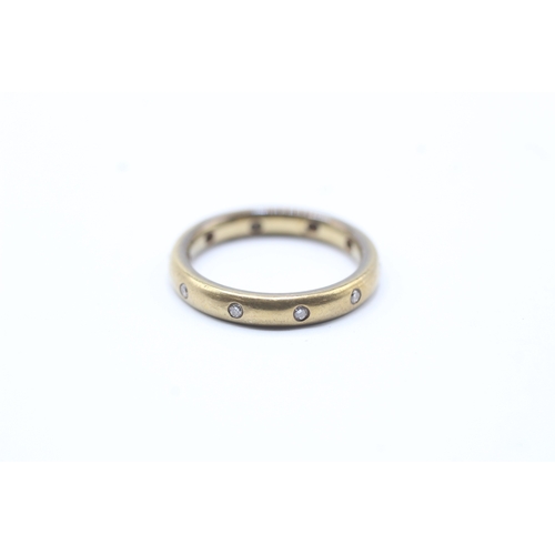 217 - 18ct gold diamond eternity ring (4.1g) Size K