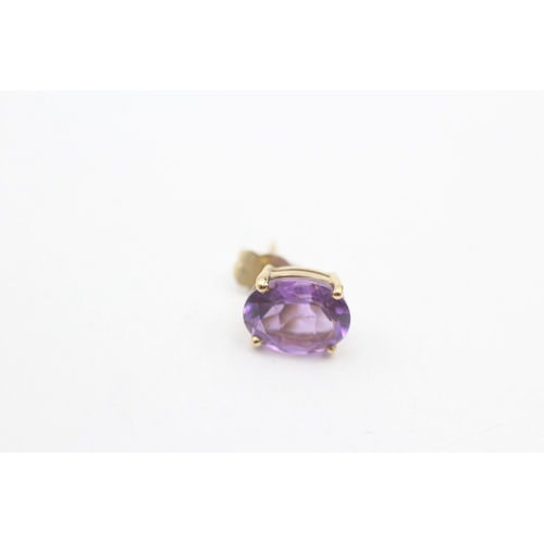 22 - 9ct gold oval cut amethyst stud earrings (2.1g)