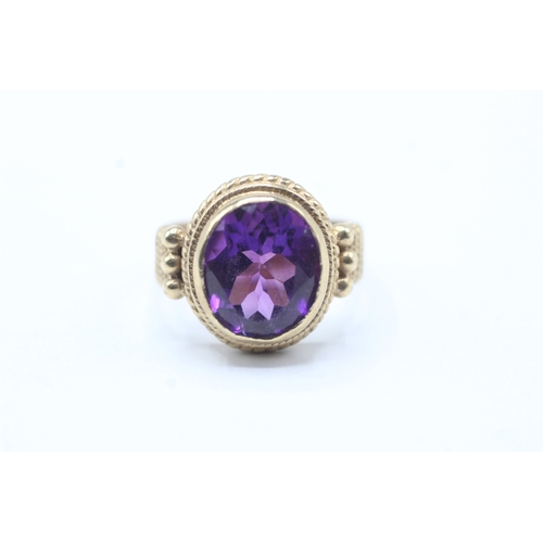 226 - 9ct gold amethyst single stone ring (4.8g) Size L