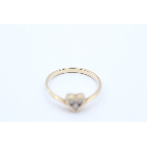 246 - 9ct gold diamond heart shape dress ring (1.5g) Size O