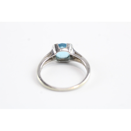 35 - 9ct gold faceted blue gemstone & diamond dress ring (2.6g) Size N