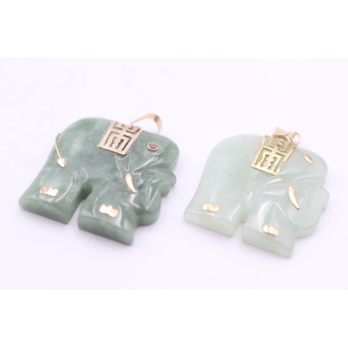 4 - 2x 9ct gold jade elephant pendants with set ruby eye (14.9g)