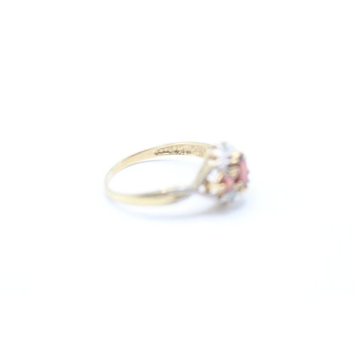 52 - 9ct gold diamond and red gemstone halo ring (2g) Size P