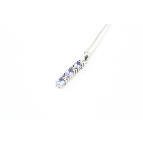 59 - 9ct gold diamond and tanzanite pendant on chain (1.7g)