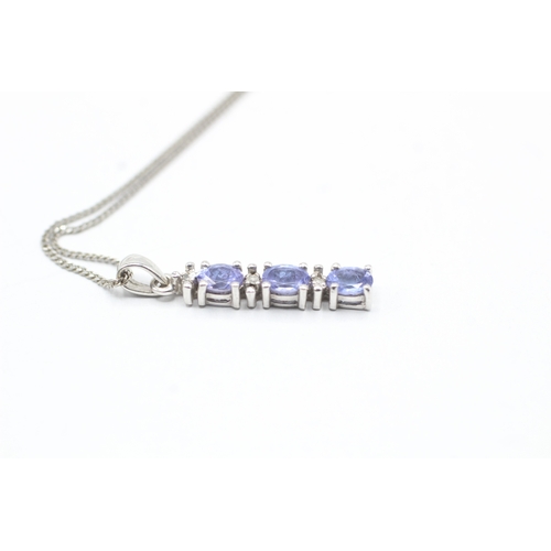 59 - 9ct gold diamond and tanzanite pendant on chain (1.7g)