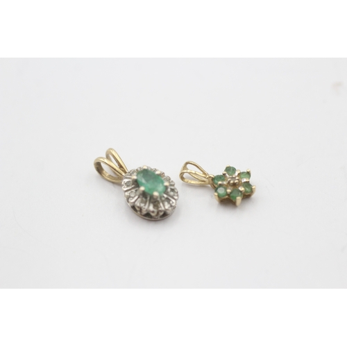 64 - 2x 9ct gold emerald & diamond cluster pendants (1.1g)