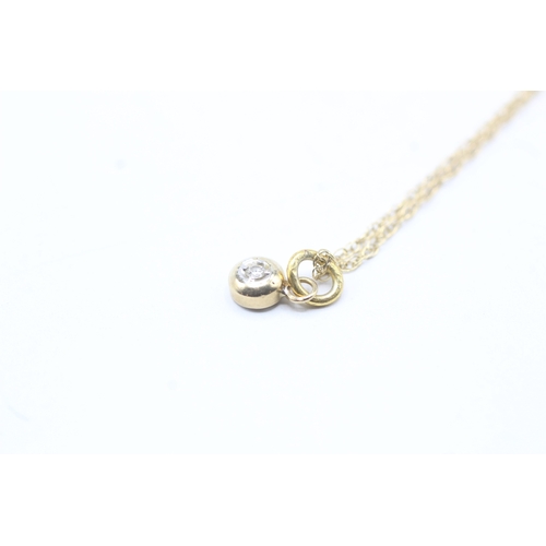 66 - 9ct gold single diamond pendant on chain (1.2g)