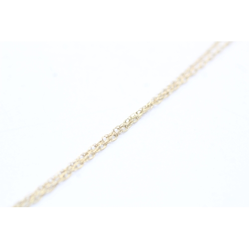 66 - 9ct gold single diamond pendant on chain (1.2g)