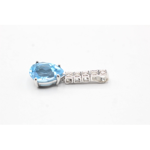 67 - 18ct white gold diamond and topaz drop pendant (2.7g)