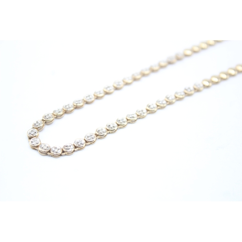 7 - 9ct gold diamond necklace (10.4g)