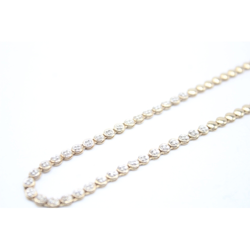 7 - 9ct gold diamond necklace (10.4g)