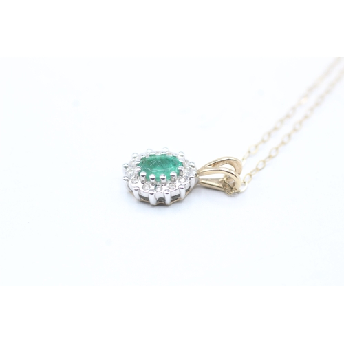 71 - 9ct gold emerald and diamond halo pendant on chain (1.6g)