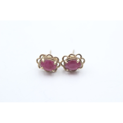 72 - 9ct gold oval cut ruby stud earrings (1.1g)