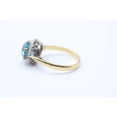 75 - 18ct gold diamond and blue gemstone halo ring (3.7g) Size L