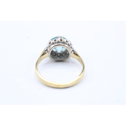 75 - 18ct gold diamond and blue gemstone halo ring (3.7g) Size L