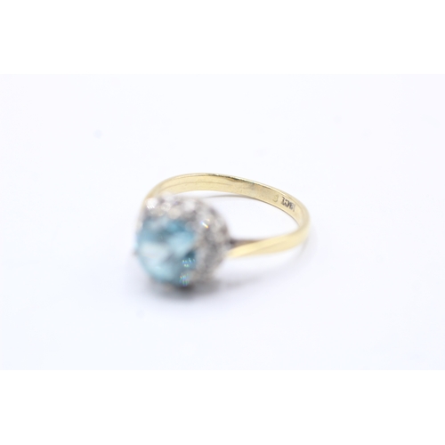 75 - 18ct gold diamond and blue gemstone halo ring (3.7g) Size L