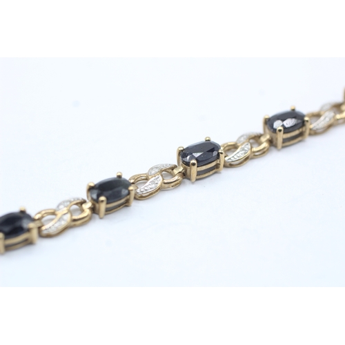 82 - 9ct gold sapphire and diamond link bracelet (8.1g)