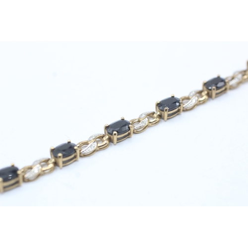 82 - 9ct gold sapphire and diamond link bracelet (8.1g)