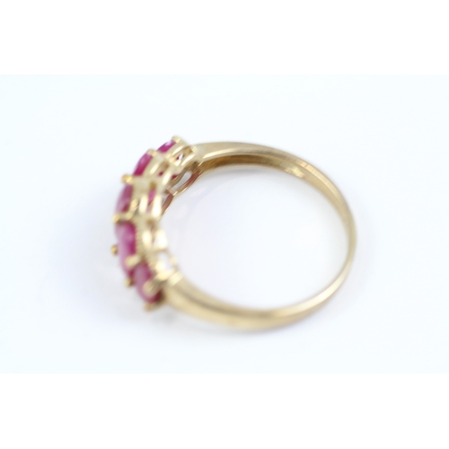 83 - 9ct gold oval cut ruby five stone ring (2.7g) Size P