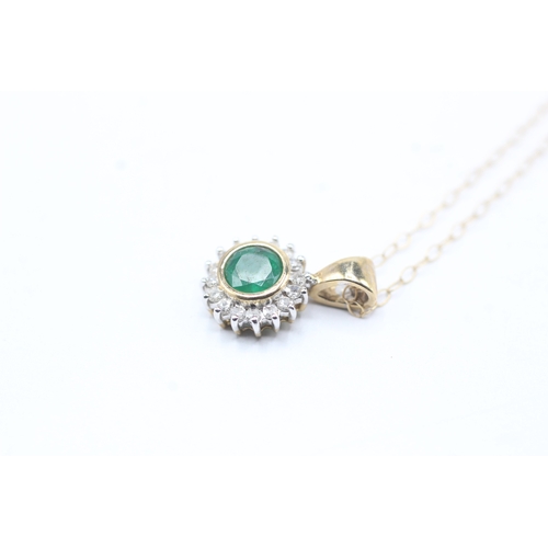 87 - 9ct gold emerald and diamond halo pendant on chain (1.5g)