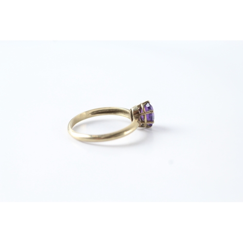 96 - 9ct gold oval cut amethyst solitaire dress ring (1.7g) Size N