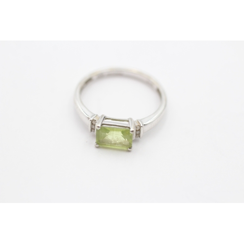 115 - 9ct gold green gemstone & diamond dress ring (1.7g) Size L