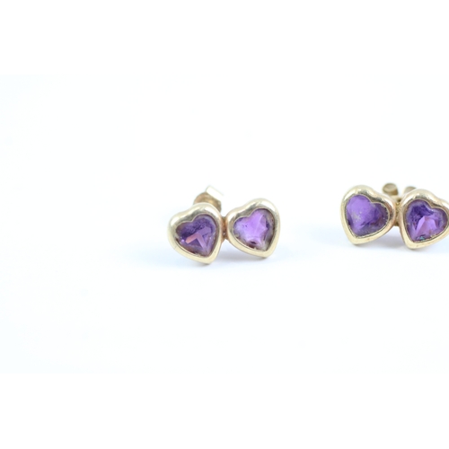 150 - 9ct gold heart cut amethyst stud earrings (0.7g)