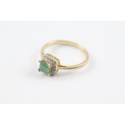 171 - 9ct gold emerald and diamond halo ring (2.3g) Size R