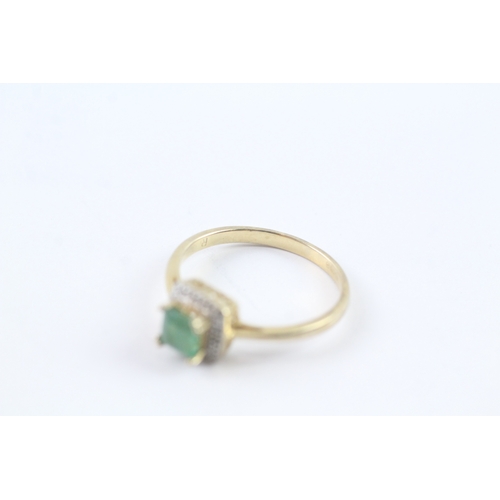 171 - 9ct gold emerald and diamond halo ring (2.3g) Size R