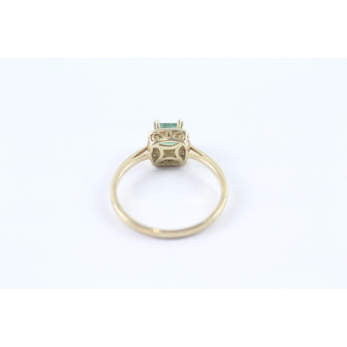 171 - 9ct gold emerald and diamond halo ring (2.3g) Size R