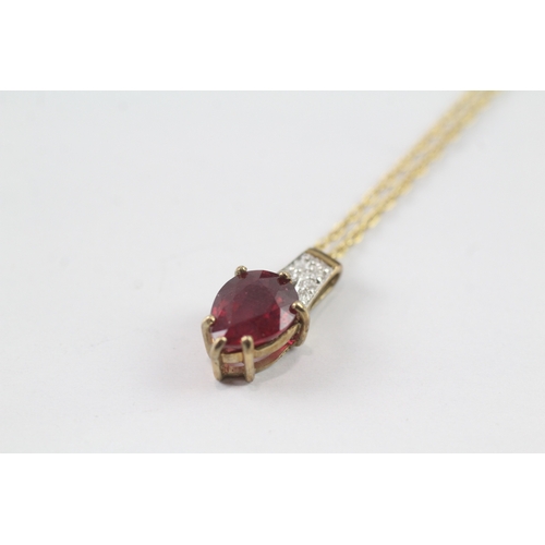 174 - 9ct gold pear cut ruby and diamond pendant w/ 9ct gold chain (2.2g)