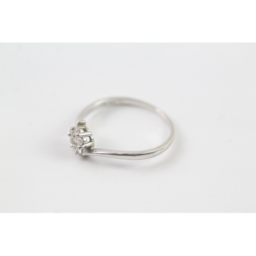 197 - 9ct white gold diamond bypass cluster ring (1.3g) Size L