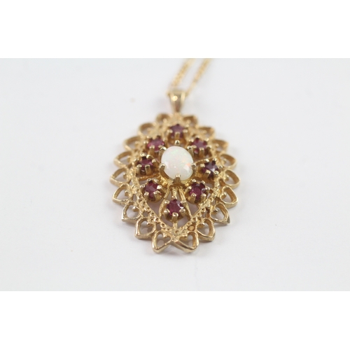 204 - 9ct gold opal and ruby cluster pendant w/ 9ct gold chain (5g)