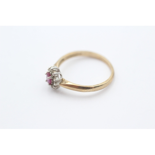 215 - 9ct gold red gemstone and diamond halo ring (1.9g) Size P