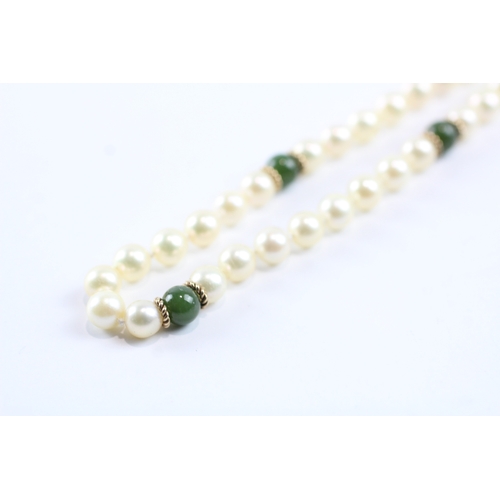 233 - 9ct gold cultured pearl & green gemstone necklace (23.8g)