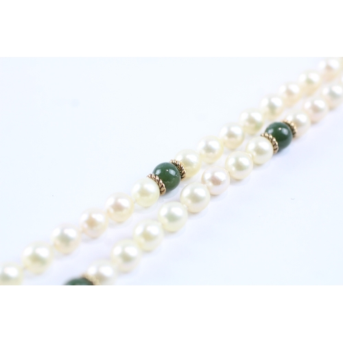 233 - 9ct gold cultured pearl & green gemstone necklace (23.8g)