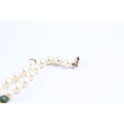 233 - 9ct gold cultured pearl & green gemstone necklace (23.8g)