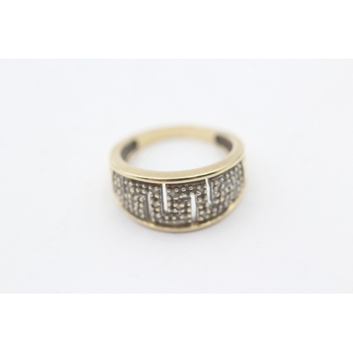 242 - 9ct gold diamond dress ring (3.1g) Size K