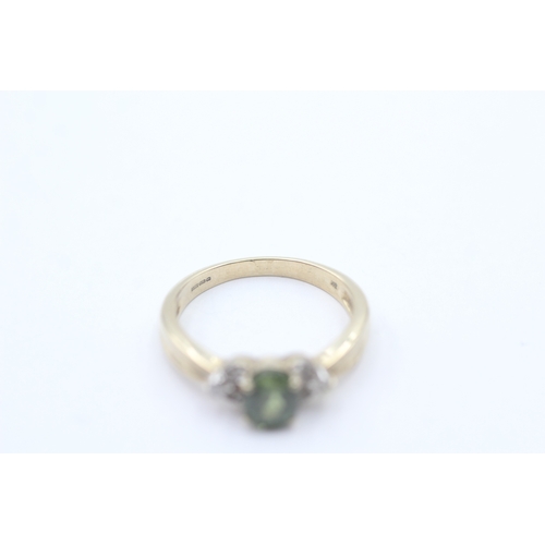 245 - 9ct gold green gemstone & diamond dress ring (2.8g) Size N