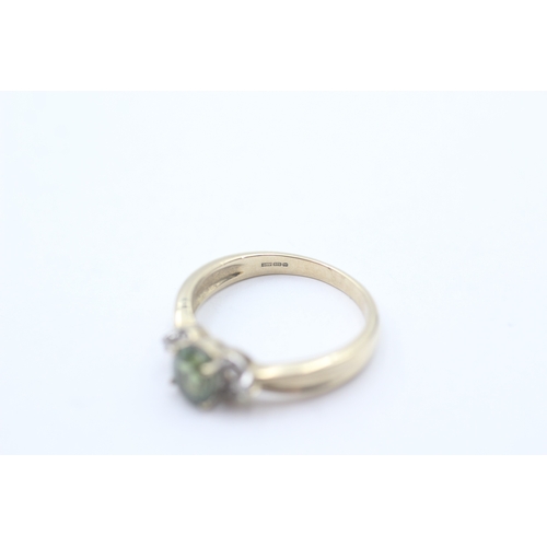 245 - 9ct gold green gemstone & diamond dress ring (2.8g) Size N