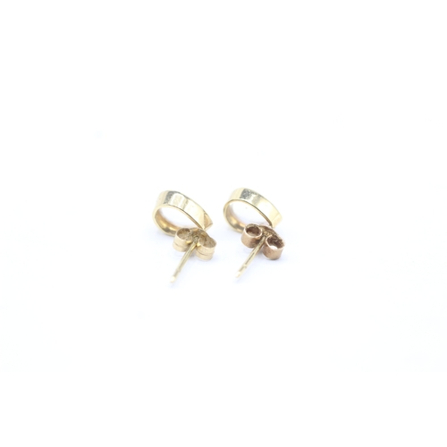 34 - 9ct gold pear cut moonstone stud earrings (0.9g)