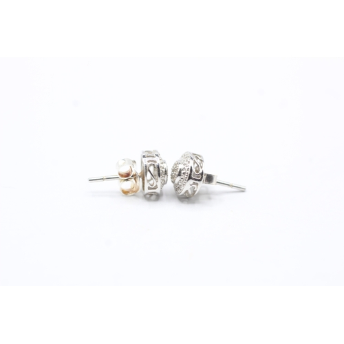 49 - 9ct gold diamond stud earrings (2g)