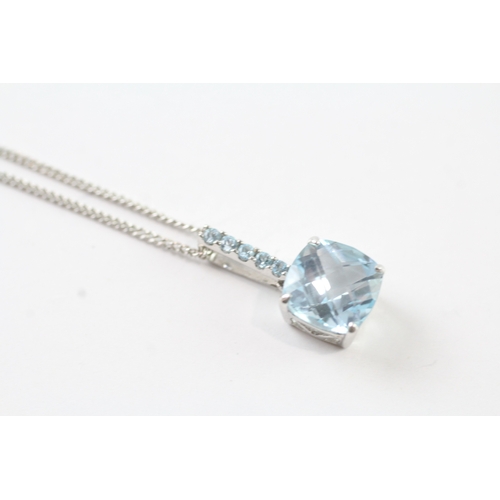 59 - 9ct white gold blue gemstone pendant w/ 9ct white gold chain (2.8g)