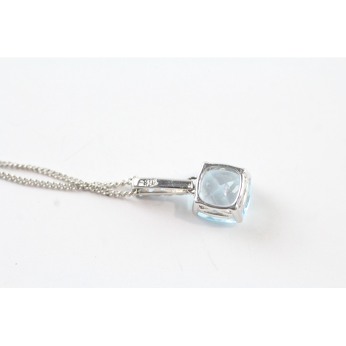 59 - 9ct white gold blue gemstone pendant w/ 9ct white gold chain (2.8g)