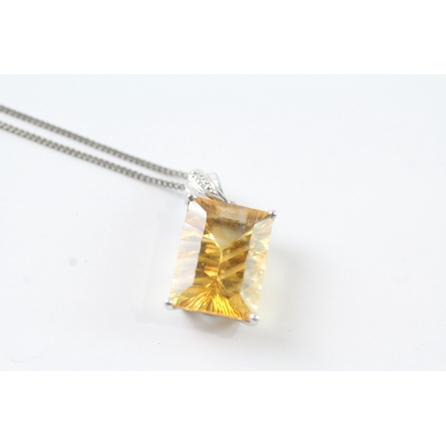 67 - 9ct white gold yellow gemstone pendant w/ 9ct white gold chain (2.6g)