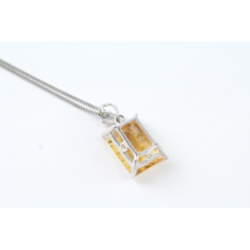 67 - 9ct white gold yellow gemstone pendant w/ 9ct white gold chain (2.6g)